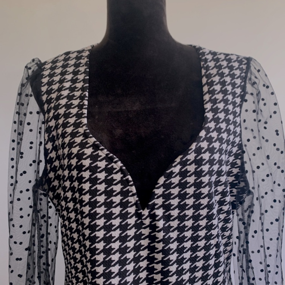 Houndstooth black and white dress with black polka dot lace sleeves.